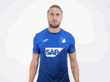 a man in a blue shirt that says sap on it