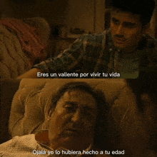 a man sitting on a couch with the words eres un valiente por vivir tu vida above him