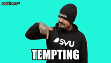 a man wearing a black hoodie with the word tempting written on it