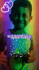 a young boy wearing a shirt that says maantaap on it