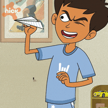 a cartoon of a boy holding a paper airplane with a nickelodeon logo behind him