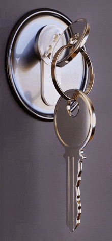 three keys are in a keyhole on a door