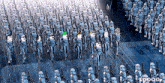 a large group of stormtroopers are marching in a row