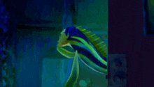 a fish with its mouth open is swimming in a dark room .