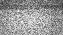 a black and white photo of a gray carpet with a grainy texture .