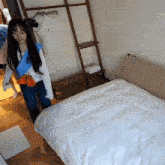 a woman standing in front of a bed with a robe that says ritz