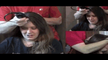 a woman is getting her hair cut by a man in a red shirt