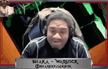 a man wearing headphones and a sign that says shaka warlock