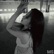 a black and white photo of a woman with the word ms on the bottom right