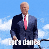 a man in a suit and tie says let 's dance on a blue background