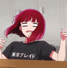 a girl with red hair and a black shirt that says tokyo blade