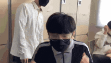 a man wearing a mask and glasses looks at something