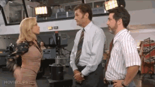 a movie clip from movieclips.com shows two men and a woman talking