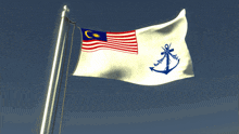 a flag with a blue anchor on it is flying in the wind