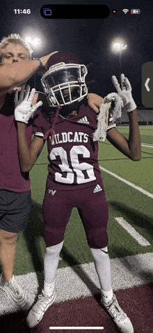 a football player wearing a jersey that says wildcats on it