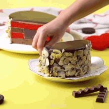 a person is decorating a cake with almonds on top