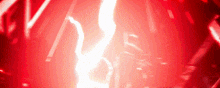 a close up of a red lightning bolt in a dark room