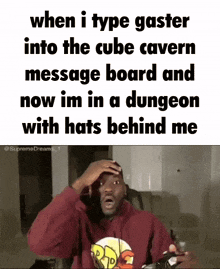 a man in a red hoodie is sitting in a chair with his hands on his head while a meme is displayed .