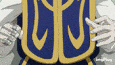 a close up of a person holding a shield with a u on it