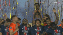 a group of soccer players holding a trophy that says champions 2025 on it