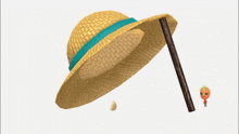 a straw hat with a blue ribbon is next to a stick and an egg