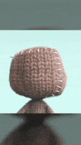a close up of a stuffed animal with stitches on it 's head