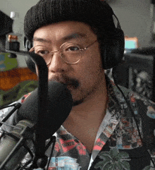 a man wearing headphones and a shirt that says ts on it