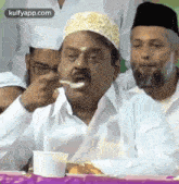 spoon got stuck in the mouth vijayakanth politician gif spoon