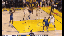 a basketball game is being played between the golden state warriors and the los angeles lakers