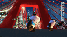two panda bears are dancing in front of a red background with chinese writing