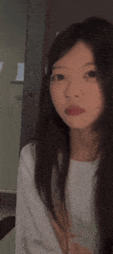 a girl with long hair is making a funny face