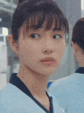 a close up of a woman making a face