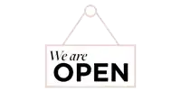 a sign that says we are open hangs on a white wall