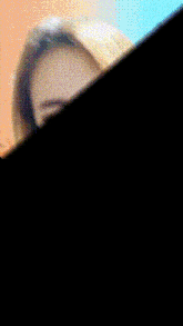 a blurry picture of a woman 's face is divided into two sections
