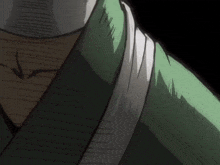 a close up of a person 's neck with a green shirt