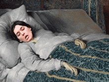 a painting of a woman sleeping in a bed with a blue blanket