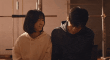 a man and a woman are playing with each other