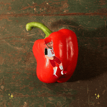 a red pepper with a picture of a person on it and the words ghost pepp on the bottom
