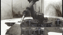 a black and white photo of a vehicle with the number 11 on the side of it