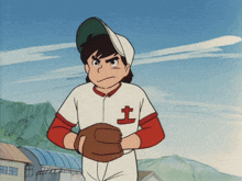 a boy in a baseball uniform has the letter t on his chest