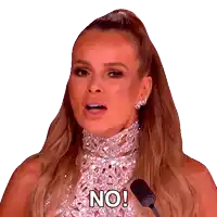 a woman speaking into a microphone with the words no on her face