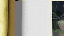 a white box is sitting on a table next to a yellow wall .