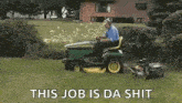 a man is riding a lawn mower in a yard with the words `` this job is da shit '' .