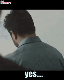 a man in a suit is standing in front of a white board and says yes ...