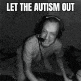 a black and white photo of a man wearing headphones .
