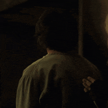 a man in a green scrub top is talking to a woman