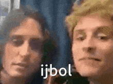 a close up of two people 's faces with the words ijbol written in white letters .