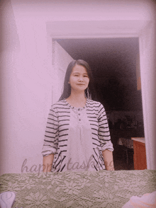 a woman in a striped shirt is standing in front of a mirror with the words happy tasking written on the bottom