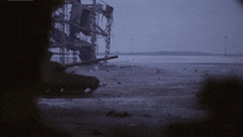 a destroyed building with a tank in the foreground