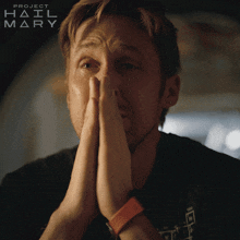 a close up of a man 's face with project hail mary written on the bottom